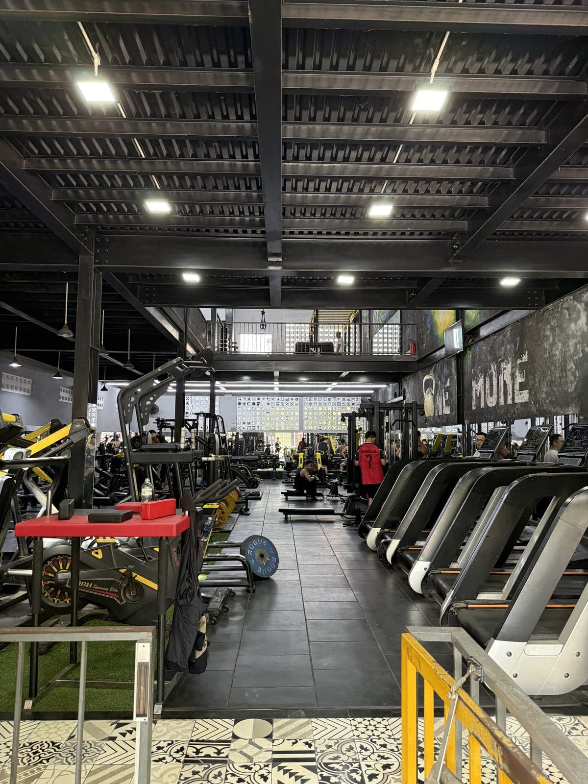 The ground floor looking towards the back, machines on the left and treadmills on the right